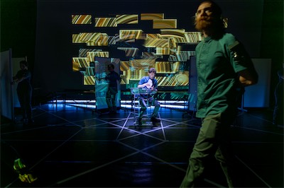 Aaron Greenberg as D-503 and Ian Cramer as S-4711.