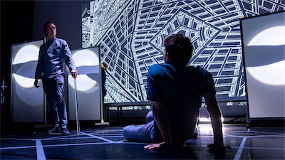 Crosby Lloyd as the Benefactor and Aaron Greenberg as D-503.